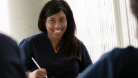 Nursing student smiling in class.